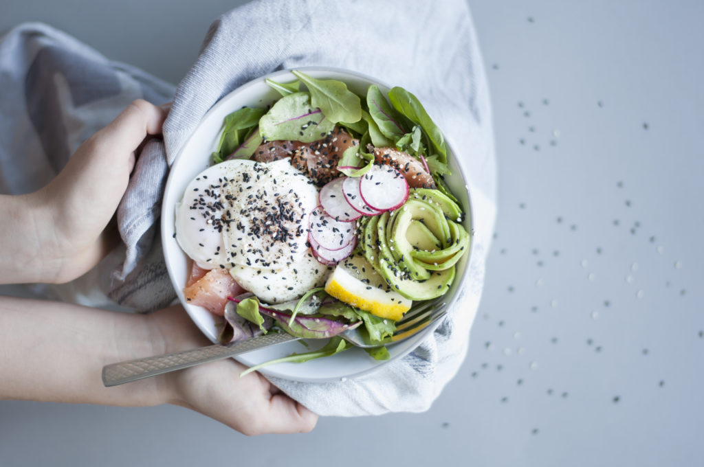 Poached eggs, avocado, salmon and greens. Source: Shutterstock